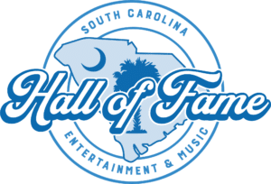Logo for the South Carolina Entertainment & Music Hall of Fame featuring a blue outline of the state with a palmetto tree and crescent moon, and bold script text reading Hall of Fame.